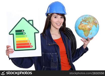 Woman holding an energy-saving drawing and a globe and wires