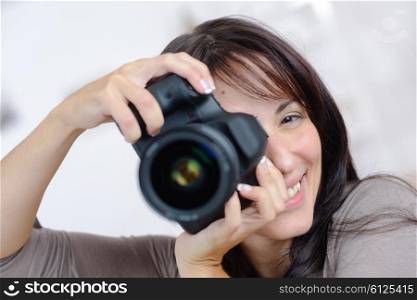 Woman holding an expensive camera