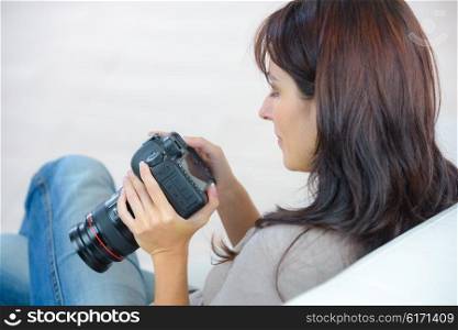 Woman holding an expensive camera