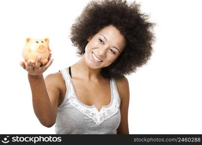 Woman holding and looking to a piggy bank