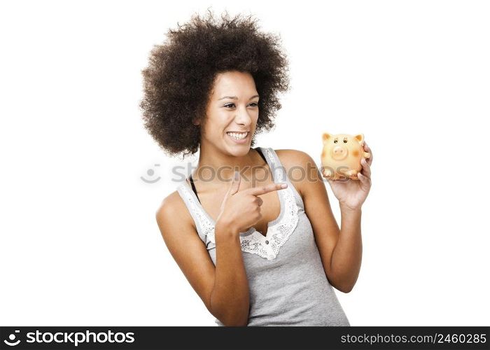 Woman holding and pointing to a piggy bank