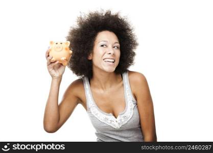 Woman holding and shaking a piggy bank