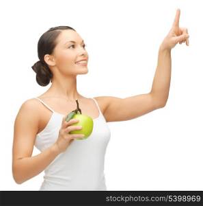 woman holding apple and working with something imaginary