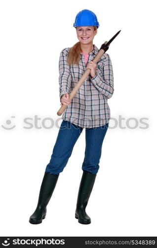 Woman holding axe over shoulder