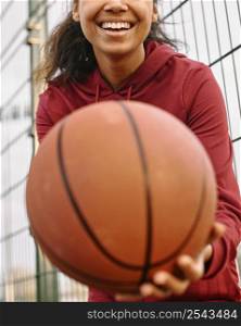 woman holding basketball close up