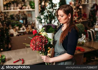 Woman holding beautiful bouquet of flowers. Florist with her work.. Florist with her work.