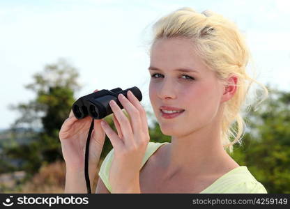 Woman holding binoculars