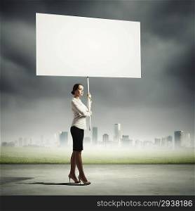 Woman holding blank board