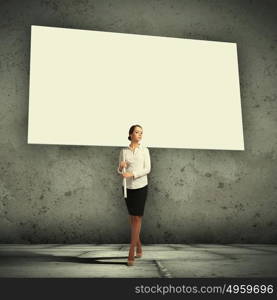 Woman holding blank board. Image of attractive woman holding blank board. Place for text