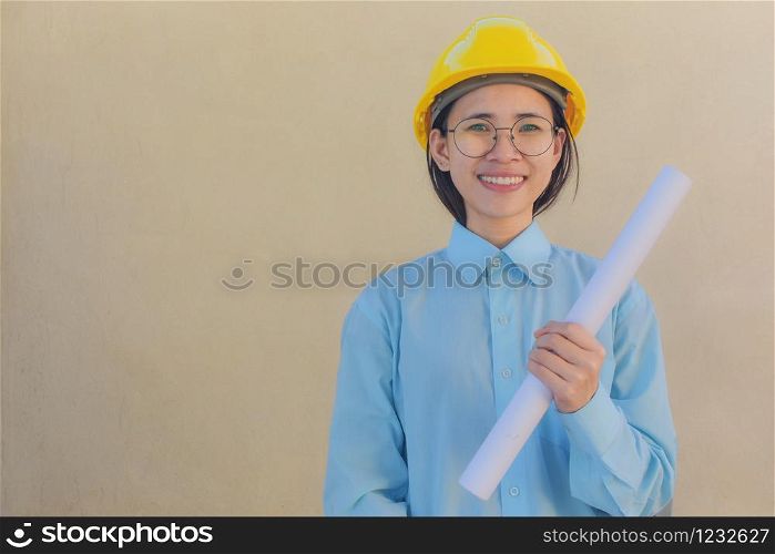 Woman holding Blueprint Helmet hard hat Foreman Building construction estate development concept