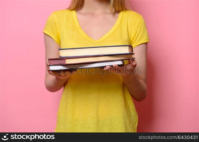 Woman holding books in hands