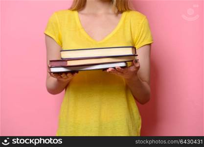 Woman holding books in hands