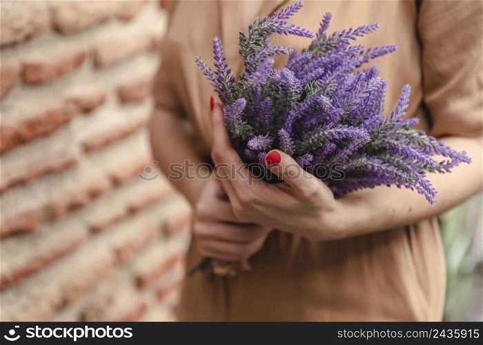 woman holding bouquet lavender