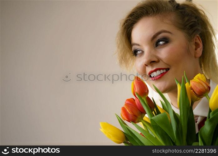 Woman holding bouquet of tulips flowers gift. Womans day, 8 march present.. Woman holding bouquet of tulips flowers