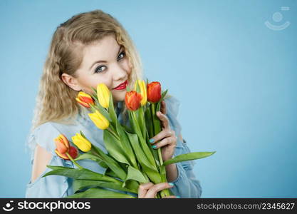 Woman holding bouquet of tulips flowers gift. Womans day, 8 march present.. Woman holding bouquet of tulips flowers