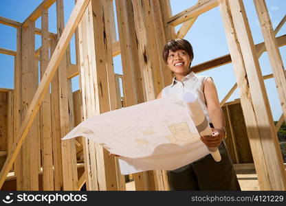 Woman Holding Building Plans