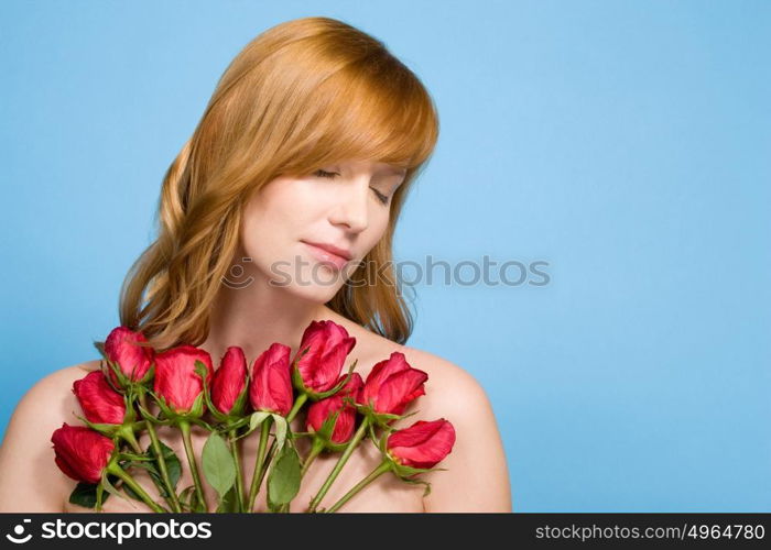 Woman holding bunch of roses