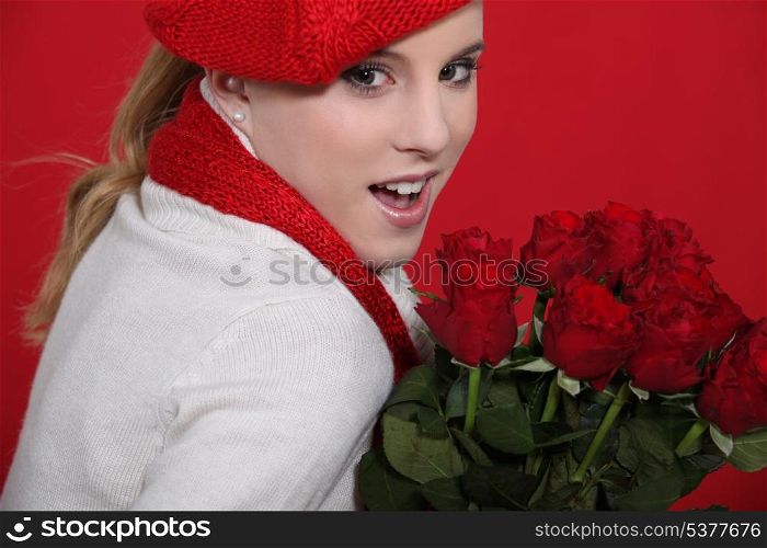 Woman holding bunch of roses