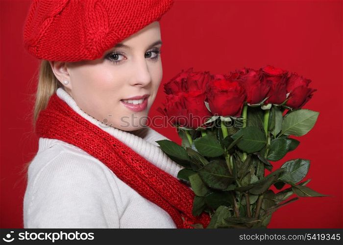 Woman holding bunch of roses