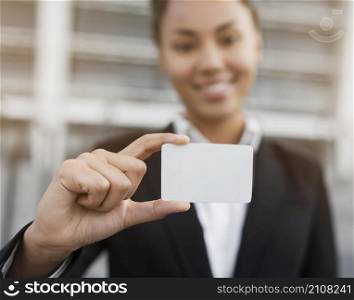 woman holding business card mock up