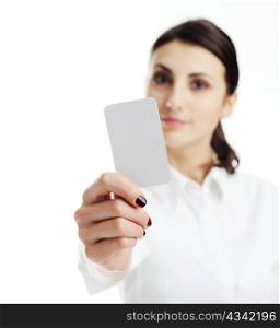 Woman holding businesscard in hand. Focus on card.
