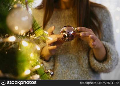 woman holding christmas tree ball