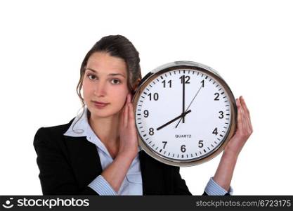 Woman holding clock