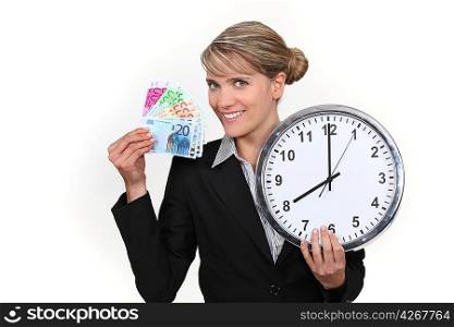 Woman holding clock and bank notes