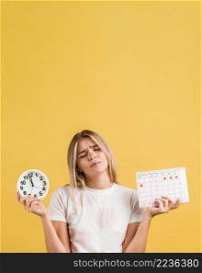woman holding clock menstrual calendar copy space