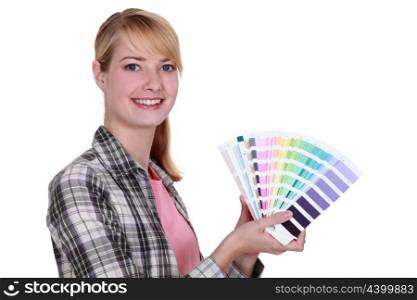 Woman holding colour samples