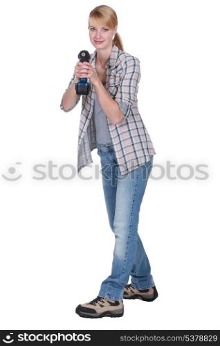 Woman holding cordless drill