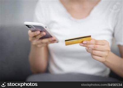 Woman holding credit card and using laptop computer for Internet online e-commerce shopping spending money Online shopping laptop technology concept . Online shopping pay by credit card 