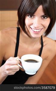 Woman holding cup of coffee portrait