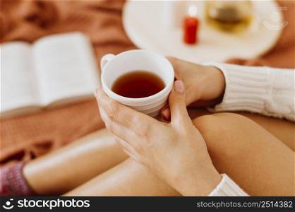 woman holding cup tea