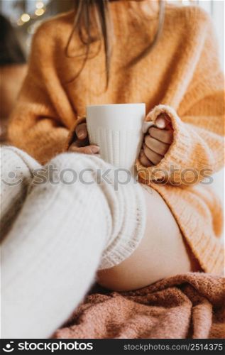 woman holding cup tea home 2