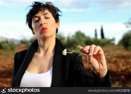 Woman holding daisy flower