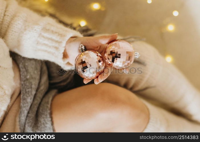 woman holding decorative tree balls