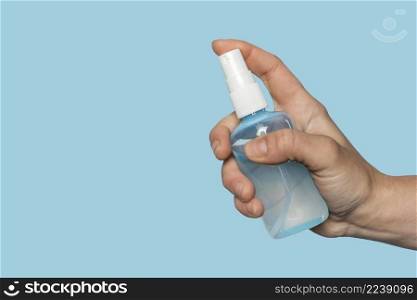 woman holding disinfectant bottle with copy space