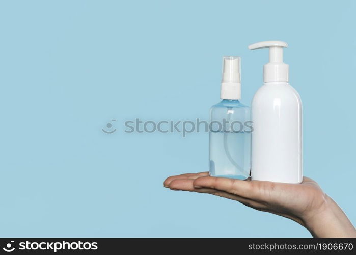 woman holding disinfectant bottles. High resolution photo. woman holding disinfectant bottles. High quality photo