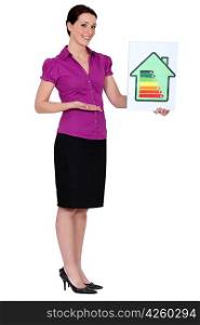 Woman holding energy rating card