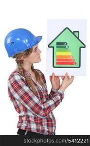 Woman holding energy-rating poster