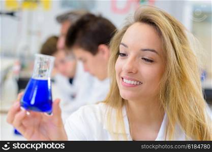 woman holding experiment result