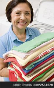 Woman Holding Folded Laundry