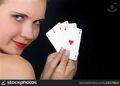 Woman holding four aces