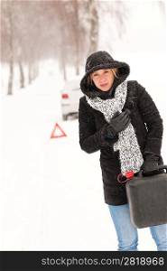 Woman holding gas can snow car breakdown winter help road