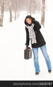 Woman holding gas can snow car trouble winter road breakdown