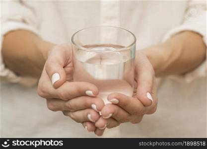woman holding glass filled with water. Resolution and high quality beautiful photo. woman holding glass filled with water. High quality beautiful photo concept