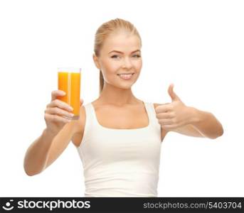 woman holding glass of orange juice and showing thumbs up