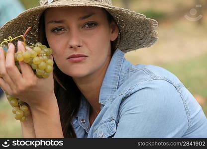 Woman holding grapes