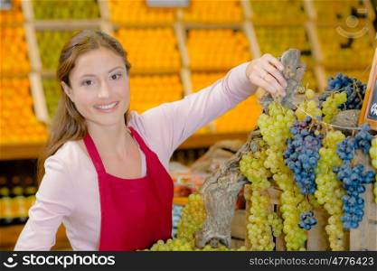 woman holding grapes